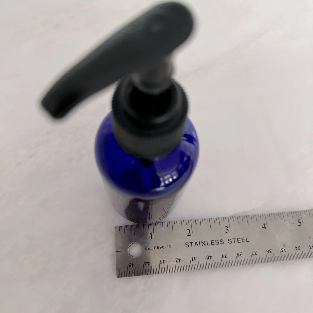 Cobalt blue glass lotion bottle